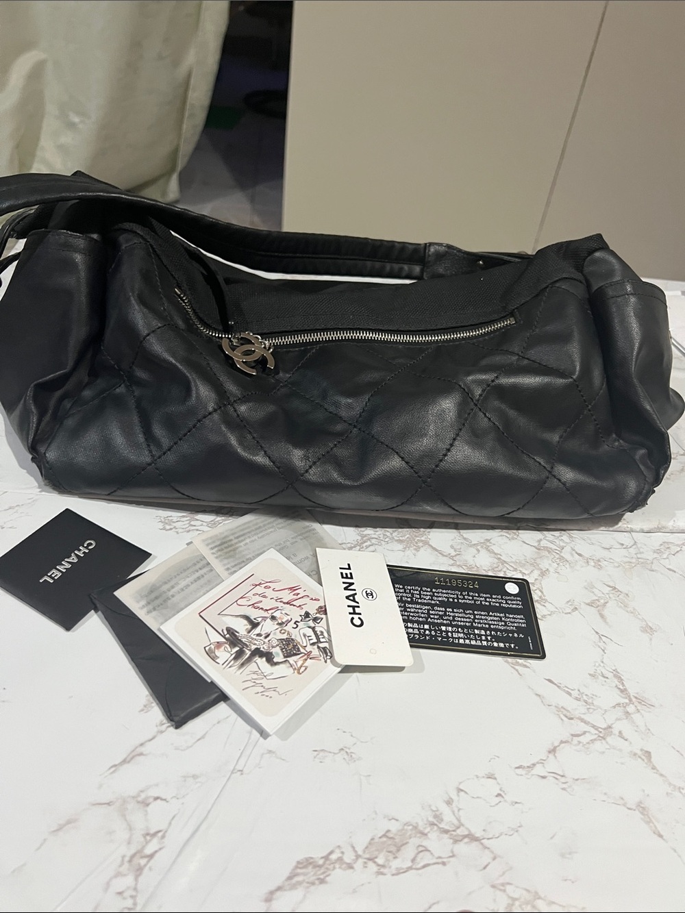CHANEL Black Quilted Shoulder Hobo with CC Charm